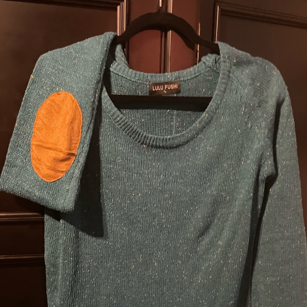 New sweater. No tags but has never been worn. Size L. Lulu Fushi brand.